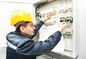 electrician checking the main switch board